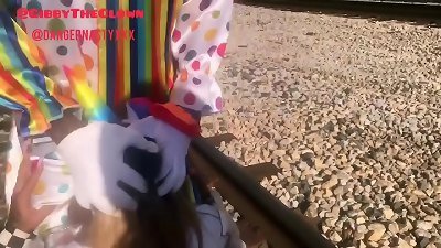 Clown almost gets hit by teach while getting head