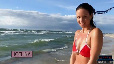 German mommy model Joelina undresses bare on the beach